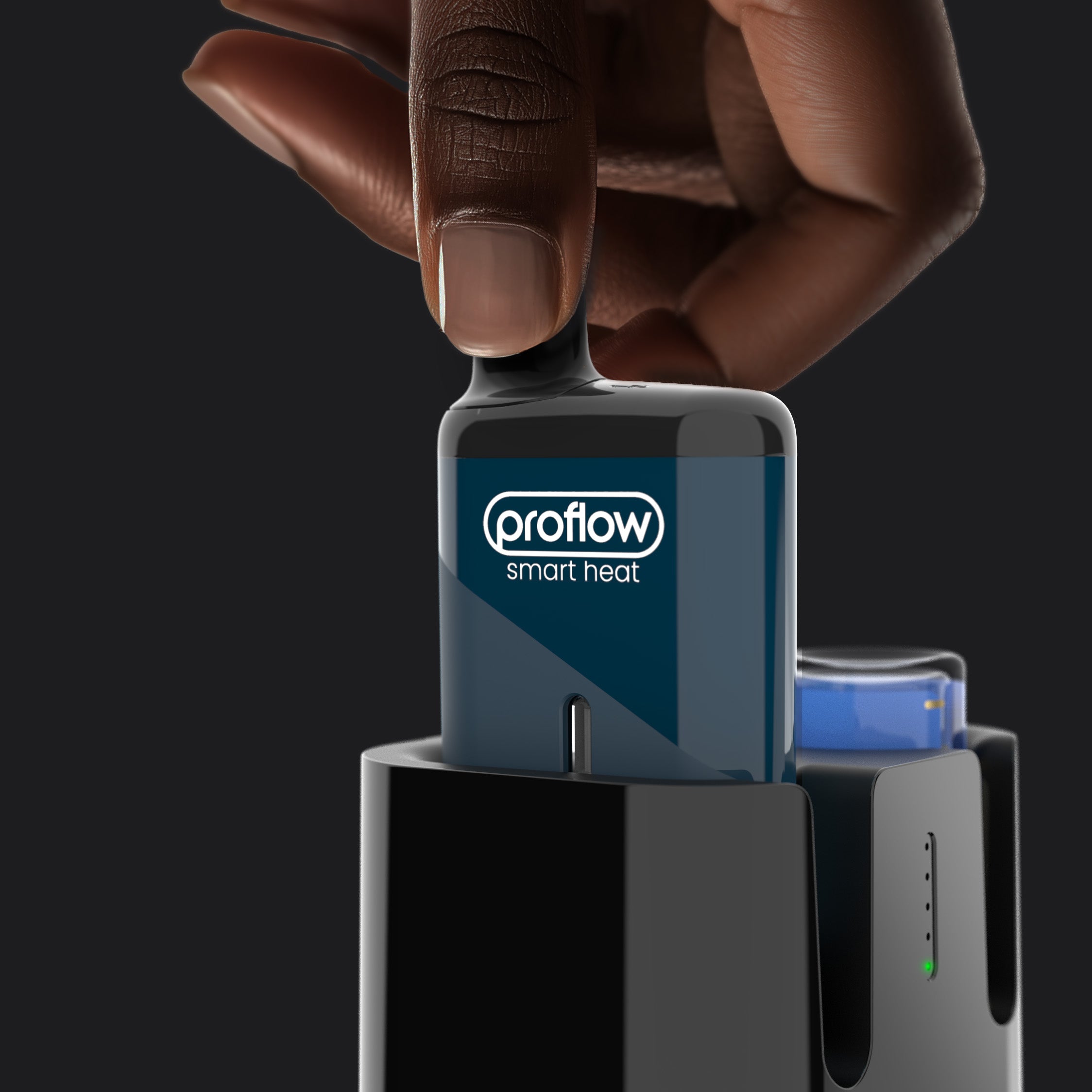 A hand places the Refilla rechargeable & refillable vape into the automatic dock