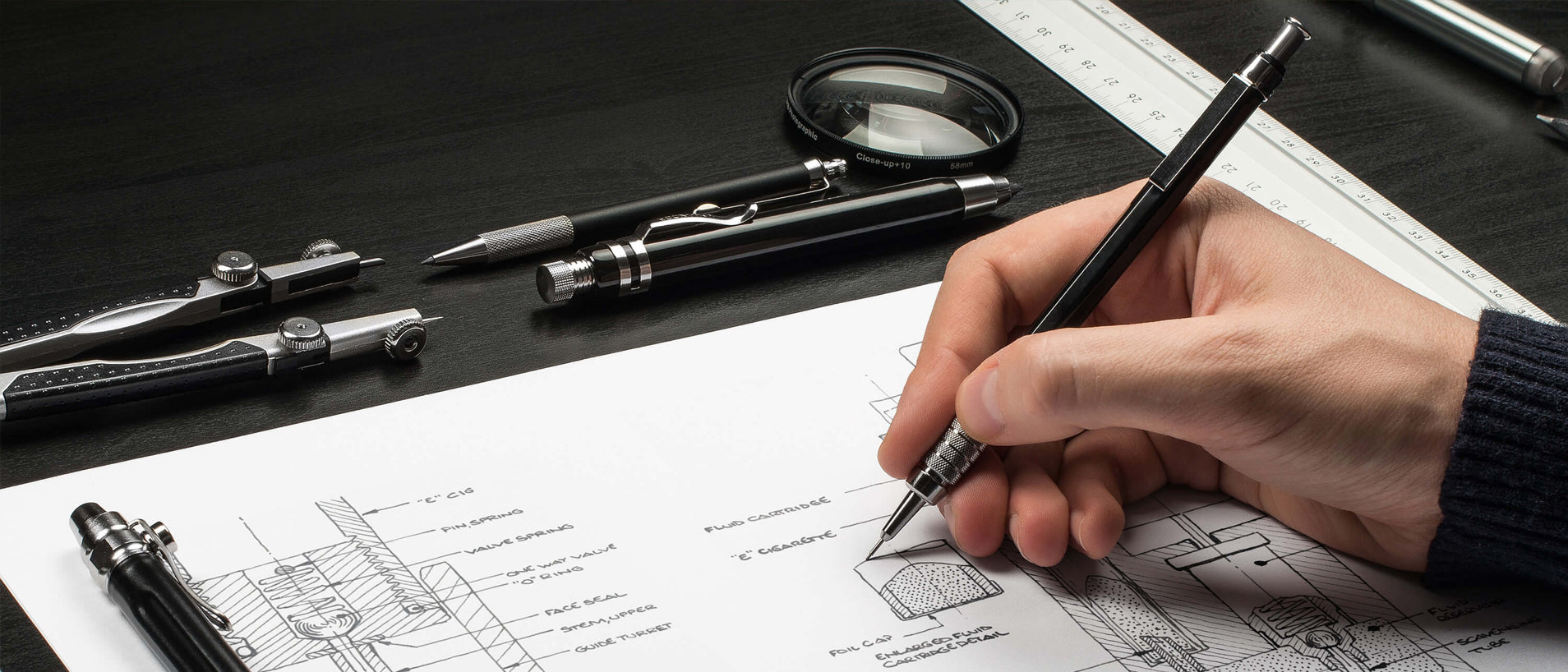 A hand sketches designs for the Refilla vape