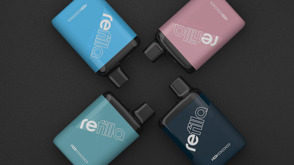 Four Refilla rechargeable vapes, in four different colours, form a pattern on textured background